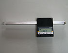 Magnetic linear scale with sliding guide
